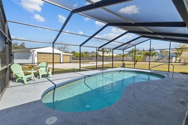 a view of a swimming pool with a patio