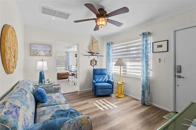 a bedroom with a bed window and a flat screen tv