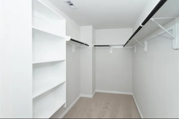 a view of an empty walk in closet