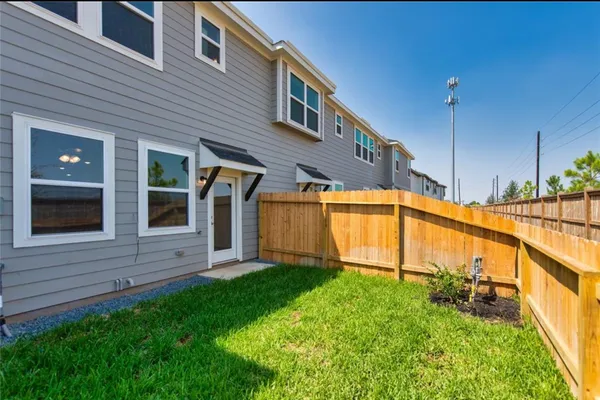 a view of a house with a small yard