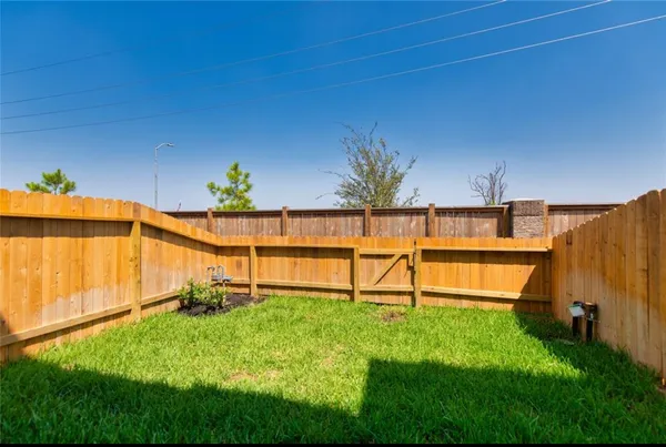 a view of backyard with a small pool