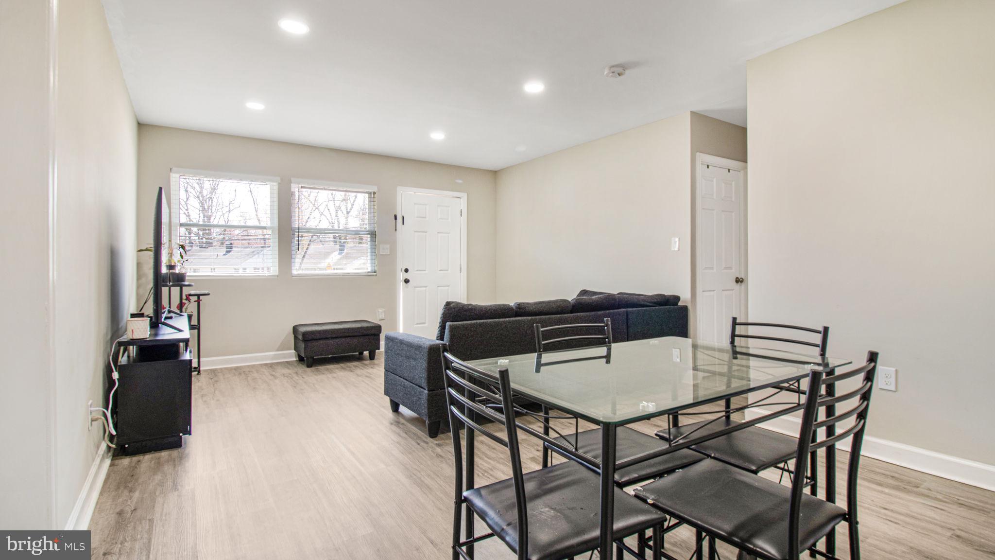 7600 Greenleaf Road Hyattsville, MD 20785 - Photo 12 of 42 a view of a dining room with furniture and a window