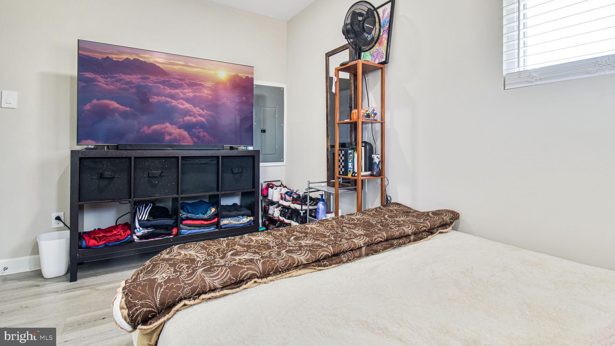 7600 Greenleaf Road Hyattsville, MD 20785 - Photo 21 of 42 a bedroom with bed and a window