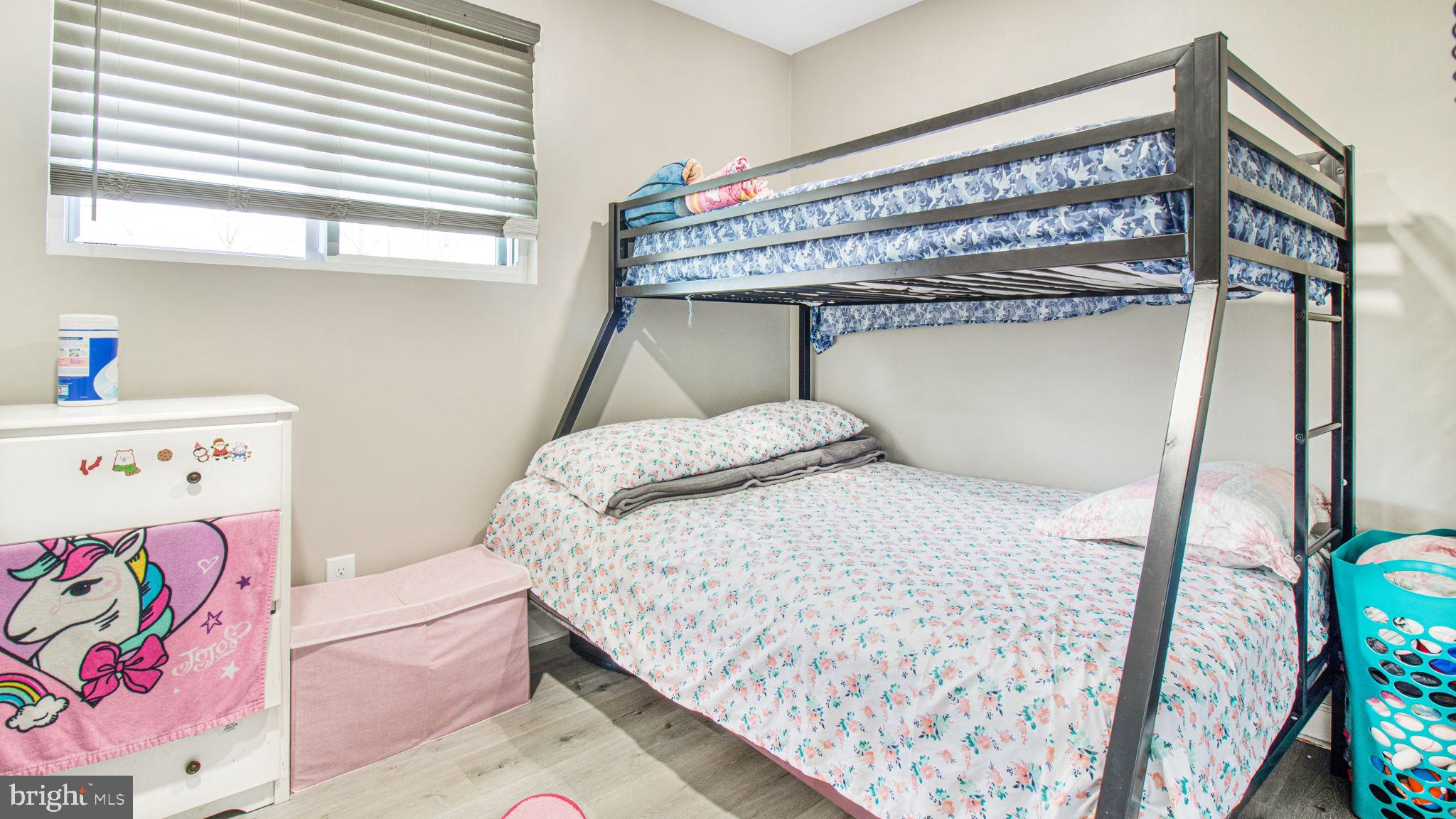 7600 Greenleaf Road Hyattsville, MD 20785 - Photo 23 of 42 a bedroom with a bed and a window