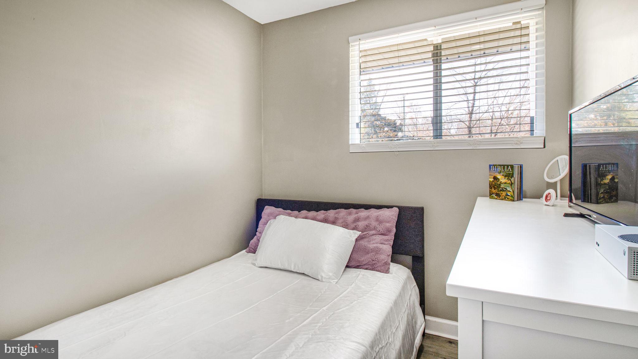 7600 Greenleaf Road Hyattsville, MD 20785 - Photo 28 of 42 a bedroom with a bed and a window