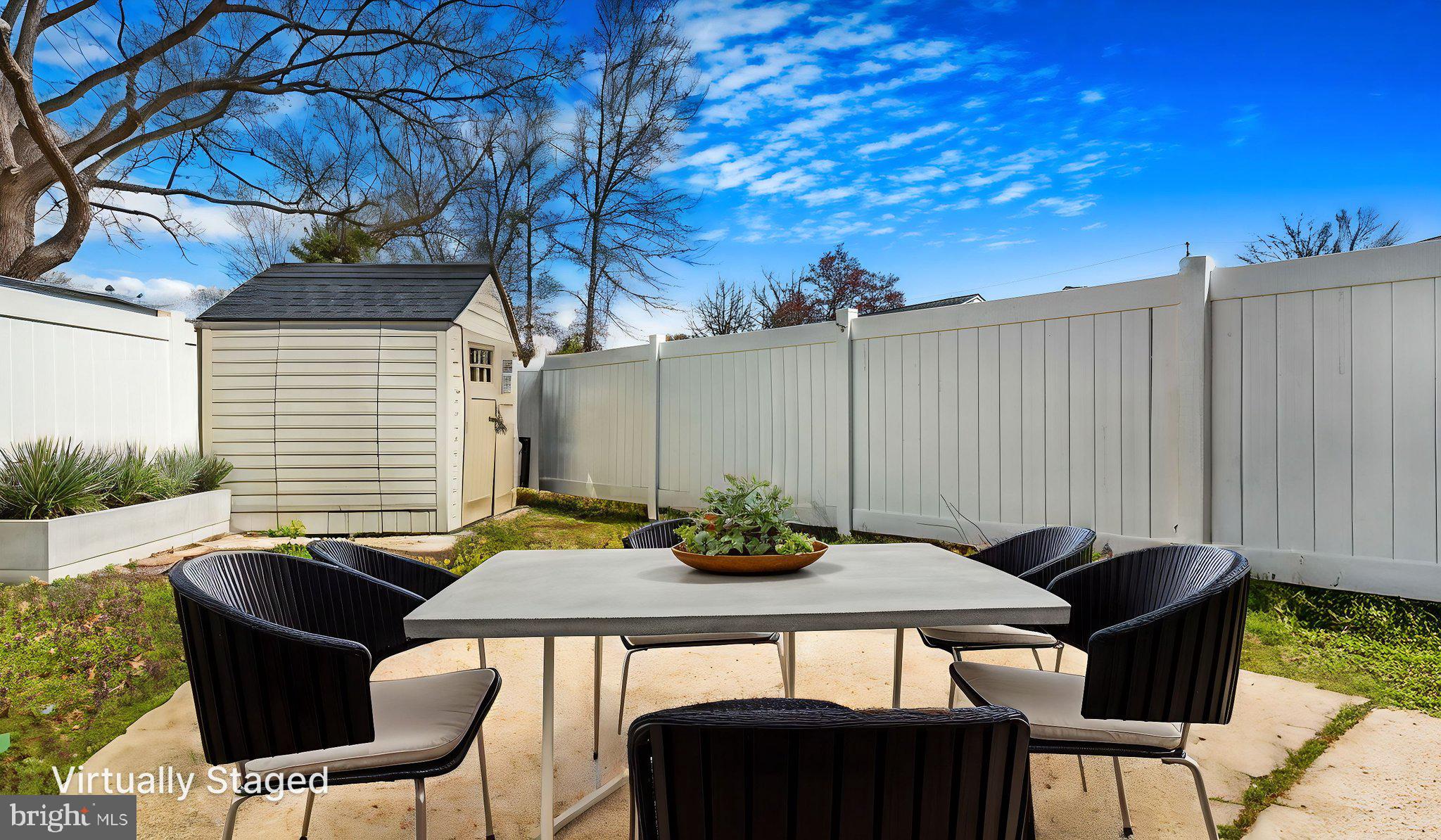 7600 Greenleaf Road Hyattsville, MD 20785 - Photo 41 of 42 a table and chairs in front of a house