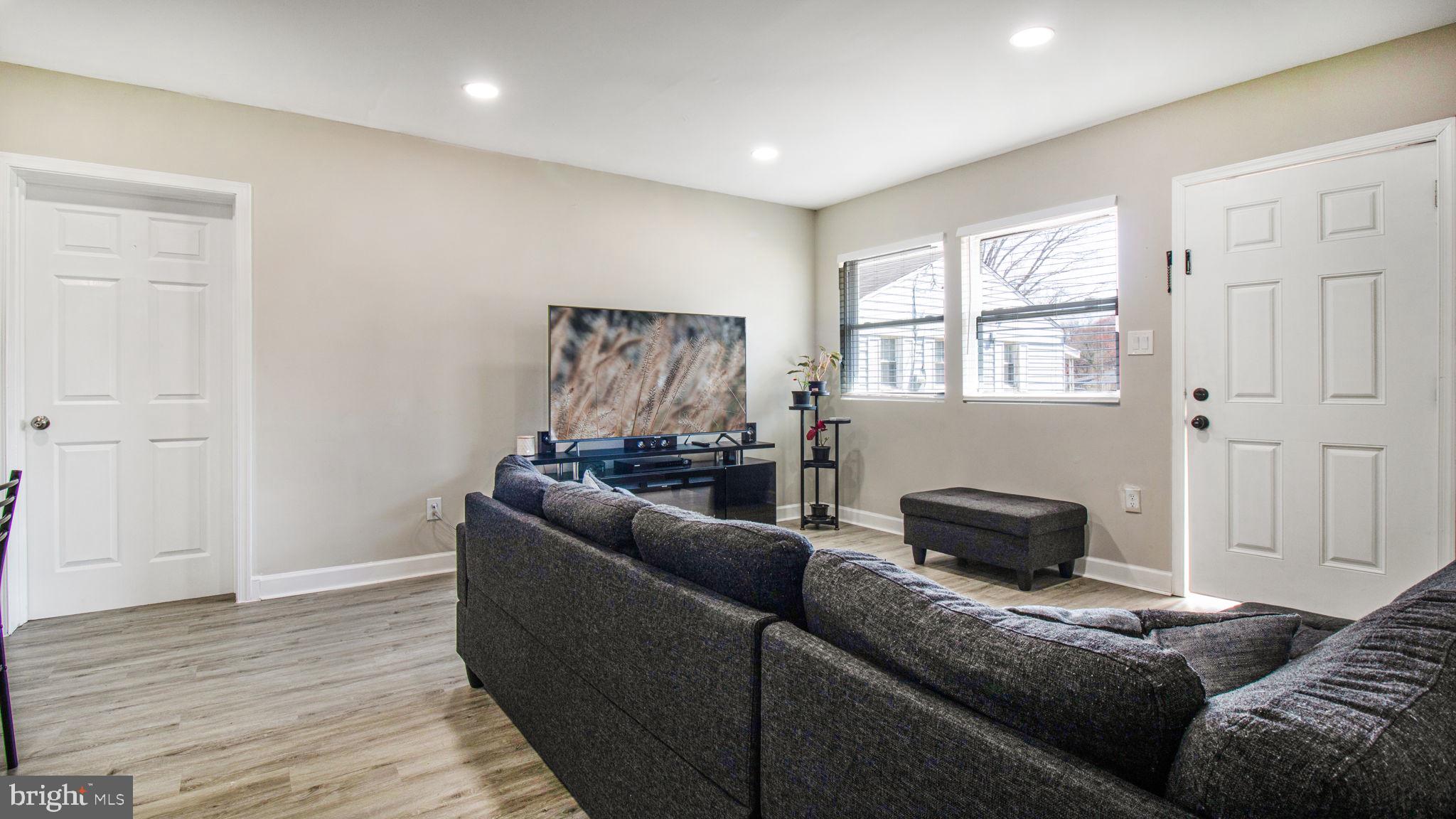 7600 Greenleaf Road Hyattsville, MD 20785 - Photo 10 of 42 a living room with furniture and a window