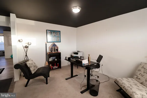 a room with furniture and gym equipment