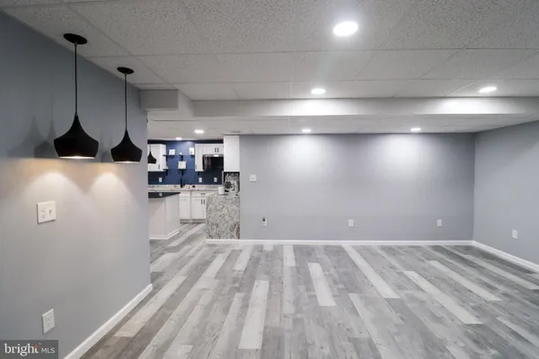 a view of a kitchen with a sink and cabinets