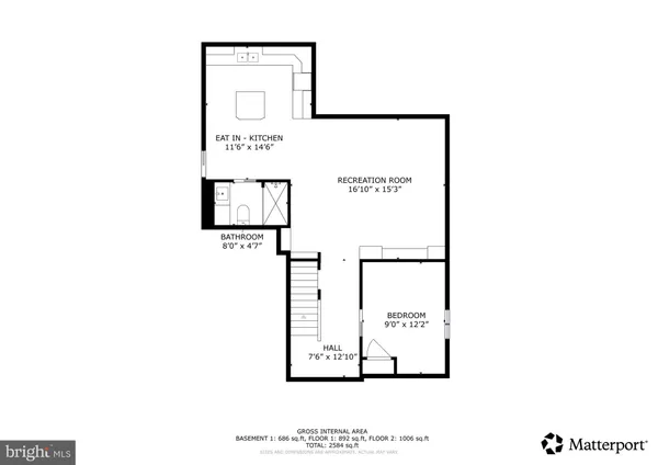 a picture of a bench in front of a wall