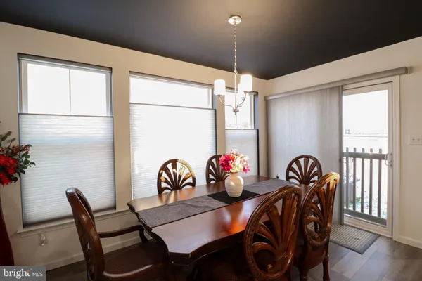 a view of a dining room with furniture and window