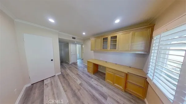 a hallway with wooden floor