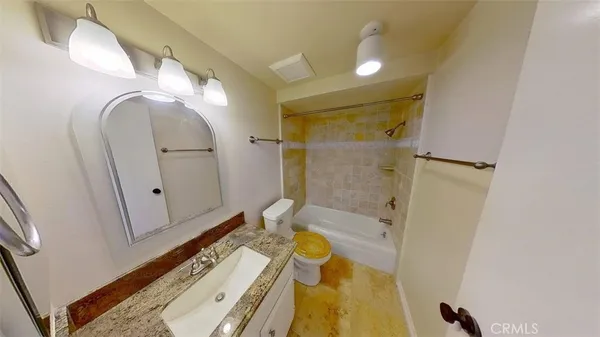 a bathroom with a tub and shower