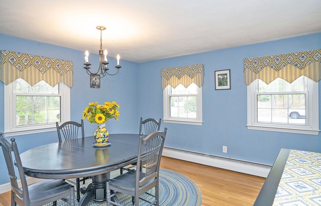 4 Gilmore Road Easton, MA 02356 - Photo 13 of 37 a view of a dining room with furniture and chandelier