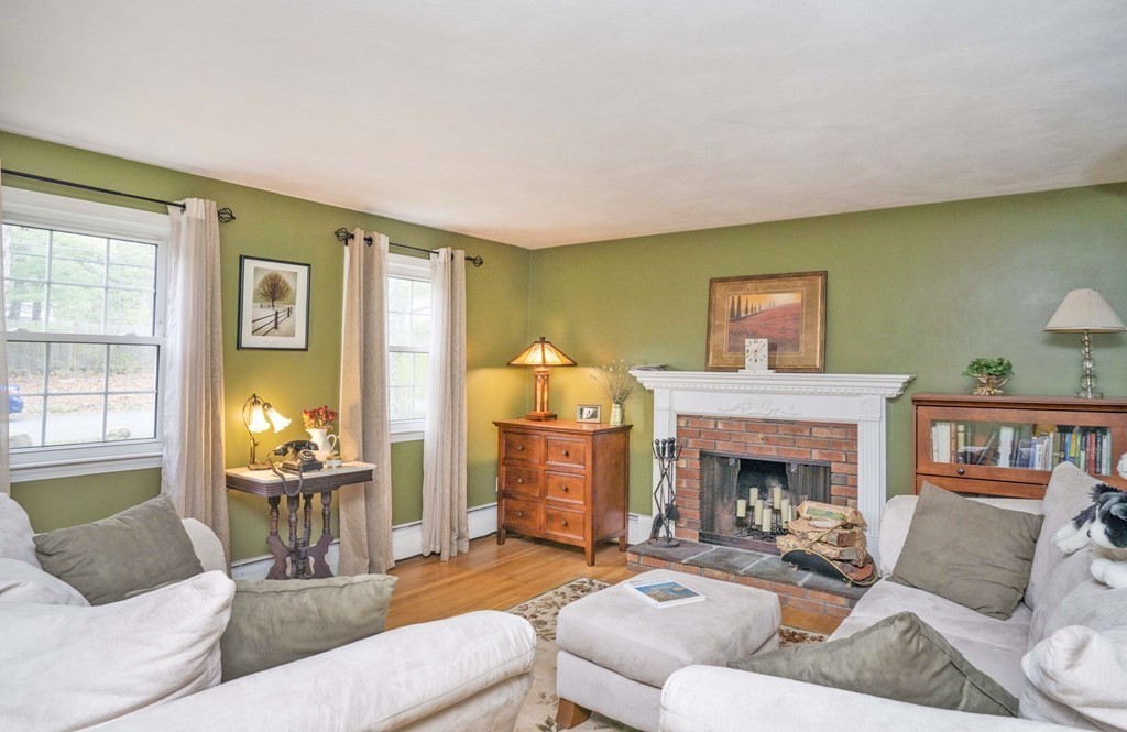 4 Gilmore Road Easton, MA 02356 - Photo 14 of 37 a living room with furniture and a fireplace