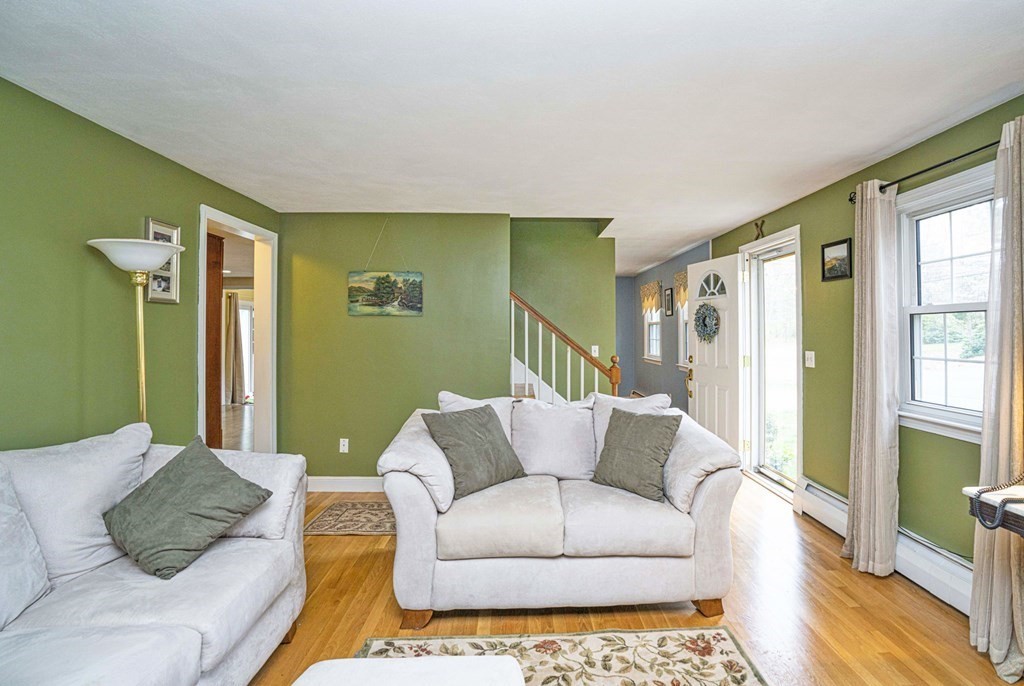 4 Gilmore Road Easton, MA 02356 - Photo 15 of 37 a living room with furniture and a rug