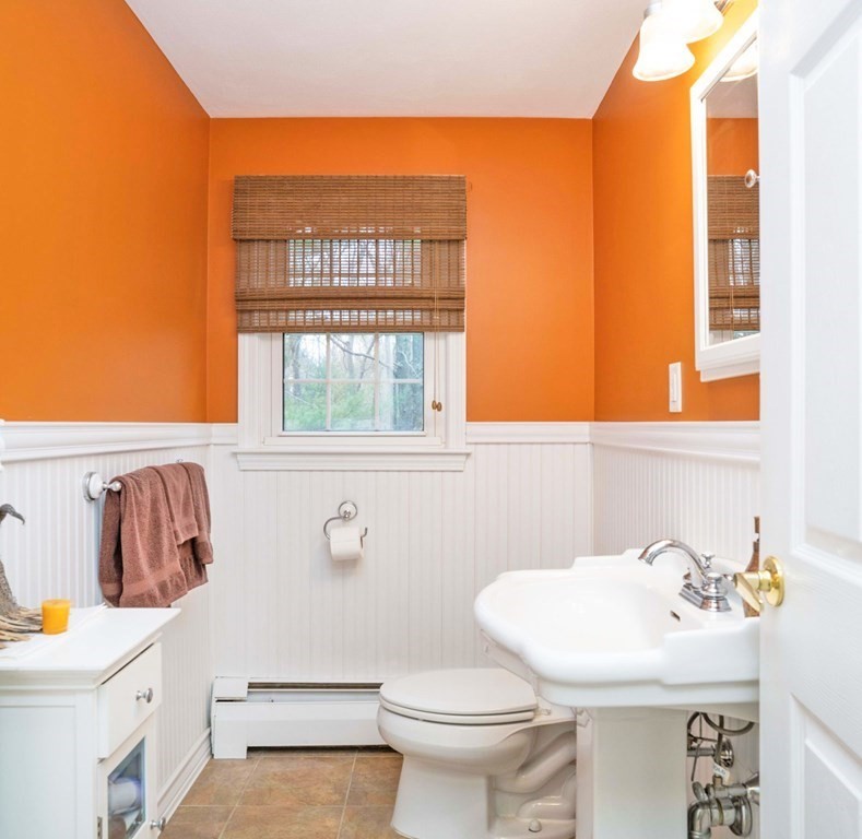 4 Gilmore Road Easton, MA 02356 - Photo 16 of 37 a bathroom with a sink a toilet and a window