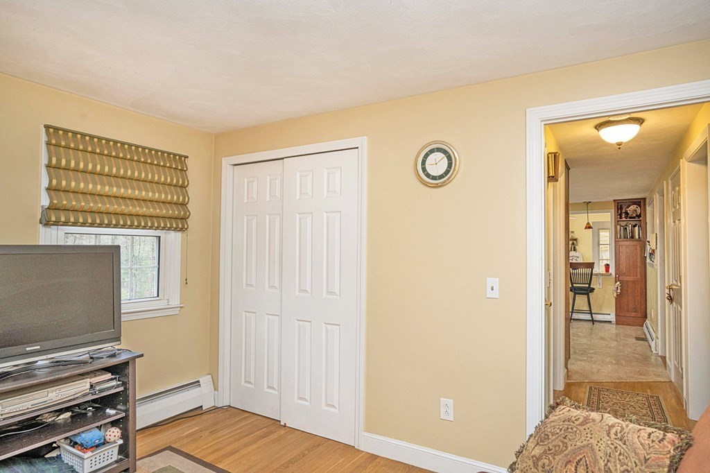 4 Gilmore Road Easton, MA 02356 - Photo 20 of 37 a view of a livingroom with wooden floor and a flat screen tv