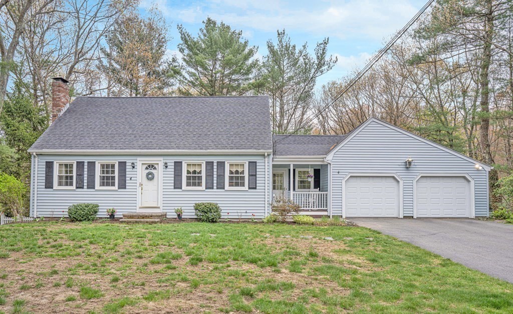 4 Gilmore Road Easton, MA 02356 - Photo 2 of 37 a front view of a house with a garden and trees