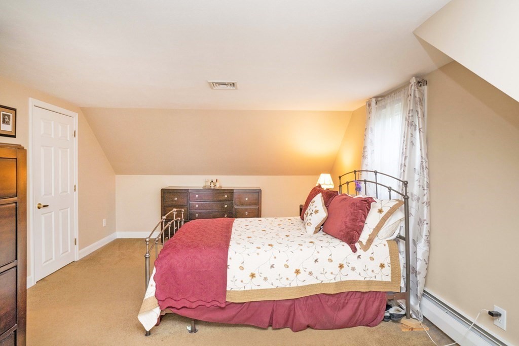 4 Gilmore Road Easton, MA 02356 - Photo 22 of 37 a bedroom with a bed and wooden floor