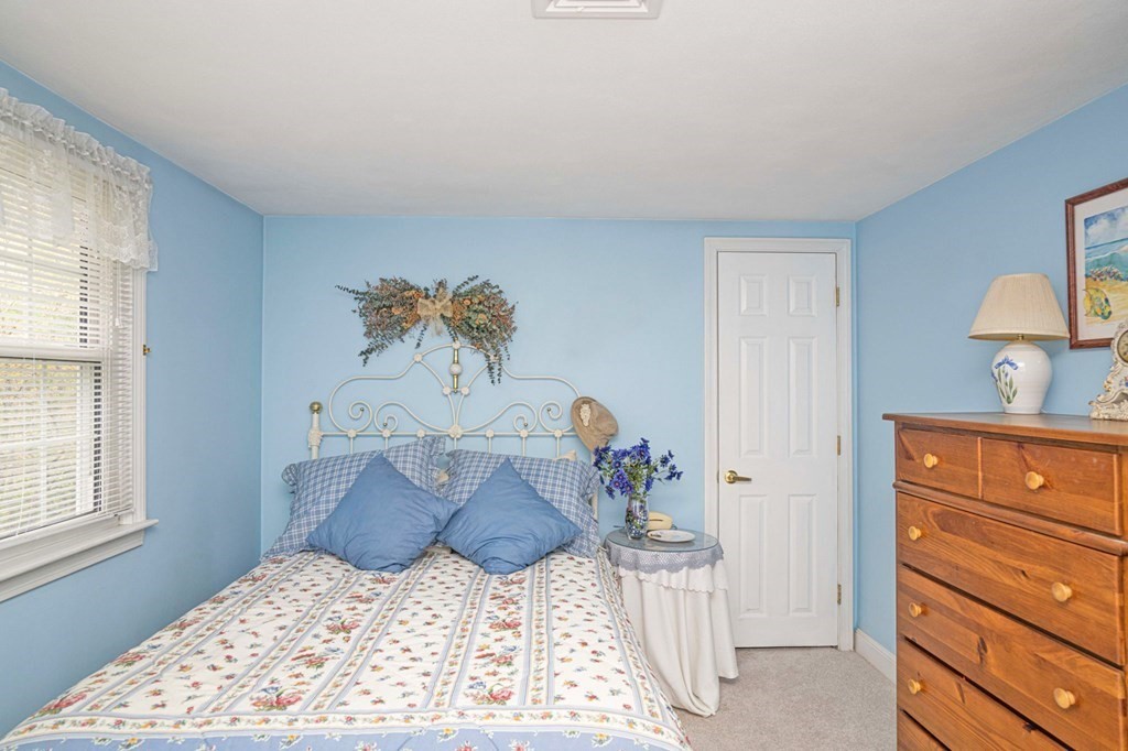 4 Gilmore Road Easton, MA 02356 - Photo 24 of 37 a large bed sitting in a bedroom next to a window