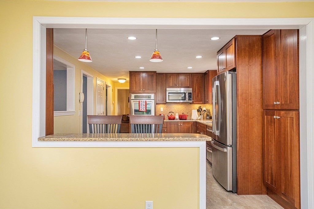 4 Gilmore Road Easton, MA 02356 - Photo 5 of 37 a view of kitchen with stainless steel appliances granite countertop a refrigerator and a sink