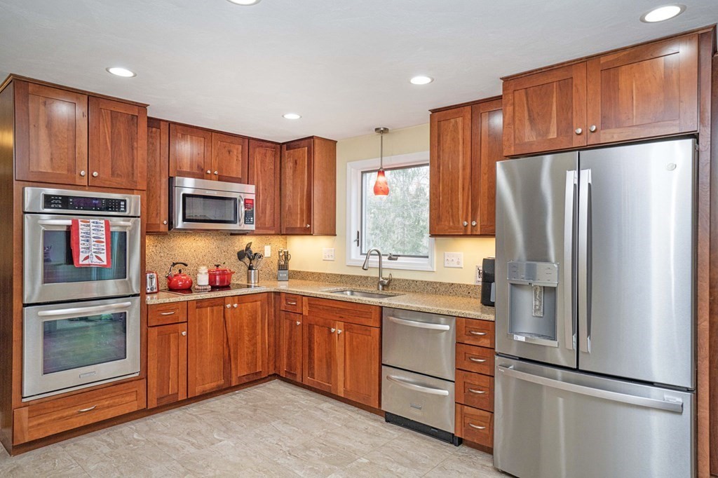4 Gilmore Road Easton, MA 02356 - Photo 7 of 37 a kitchen with stainless steel appliances granite countertop a refrigerator stove top oven and sink