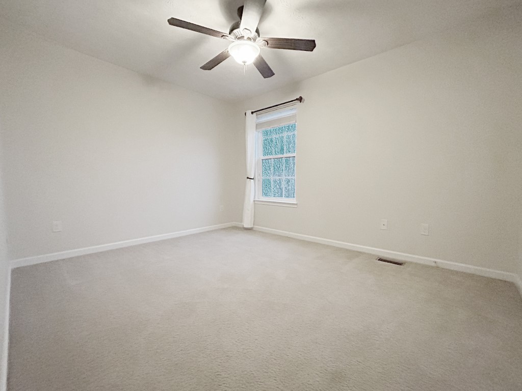 1978 Spring Ridge Drive Xenia, OH 45385 - Photo 25 of 44 This spacious bedroom offers ample natural light and a comforting atmosphere.