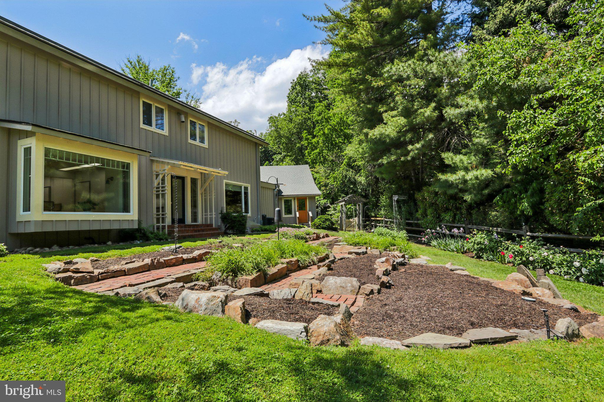 1673 Paper Mill Road Jenkintown, PA 19046 - Photo 69 of 73 a view of backyard of house with outdoor seating and green space