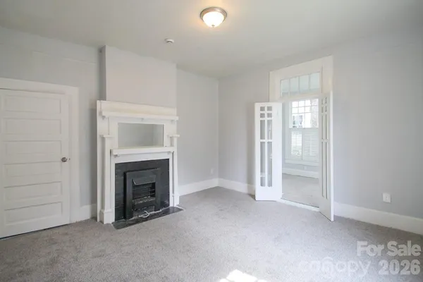 an empty room with fireplace
