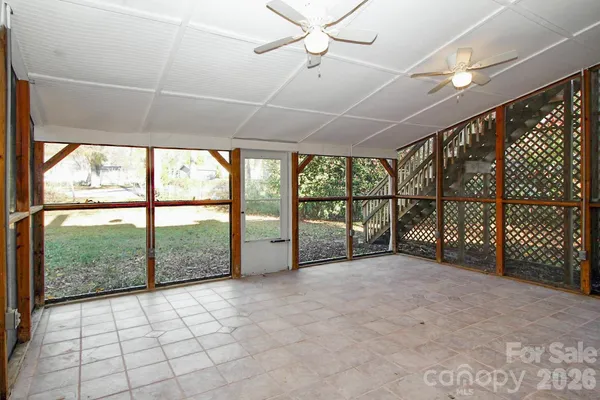 a view of an empty room with a balcony
