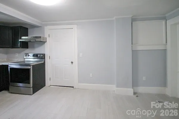 a kitchen with stainless steel appliances a stove and a refrigerator