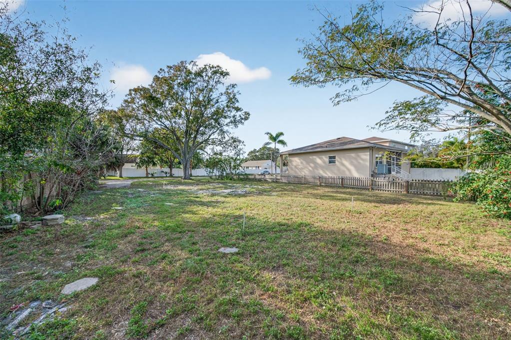 6311 Hobson Street Northeast St. Petersburg, FL 33702 - Photo 4 of 41 a view of a house with a yard