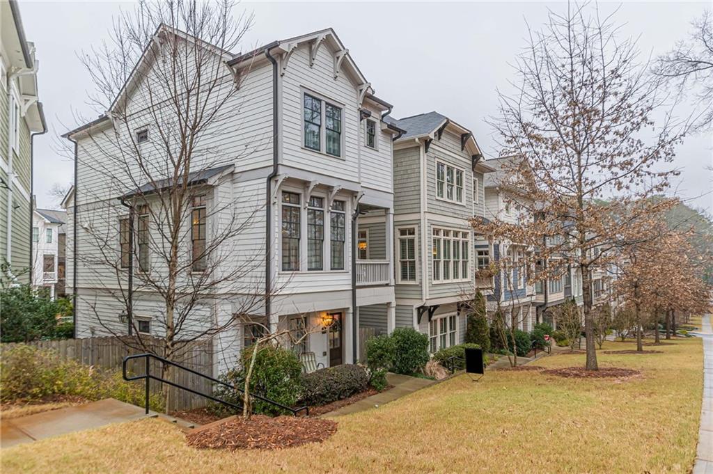 2834 Haven Lane Decatur, GA 30030 - Photo 1 of 1 a front view of a residential apartment building with yard and parking