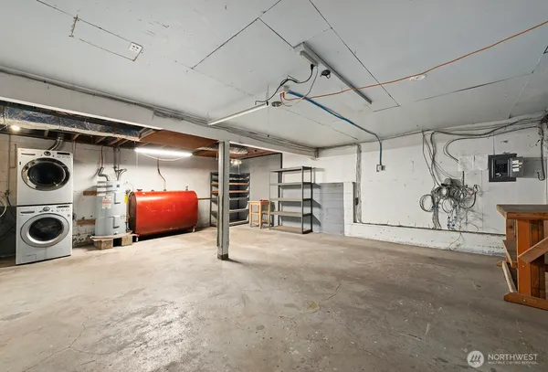 a view of a storage and utility room with washer and dryer
