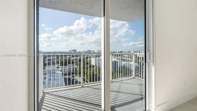 a view of a balcony with floor to ceiling window