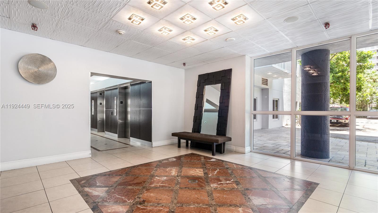 850 North Miami Avenue, Unit W1707 Miami, FL 33136 - Photo 23 of 35 a view of a hallway with furniture and a large window