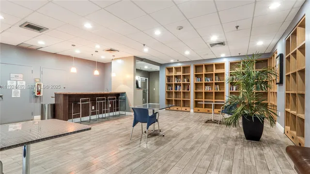 a livingroom with furniture window and wooden floor