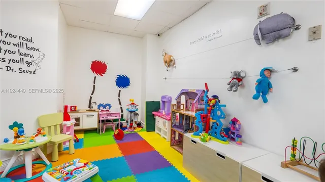 a play room with toys and a couch