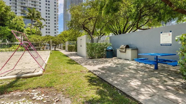 a view of a backyard with a table and chair