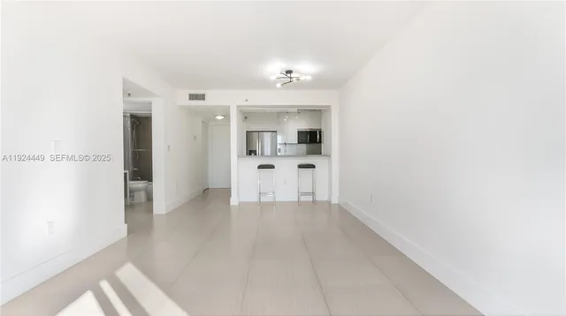a view of a kitchen with a sink
