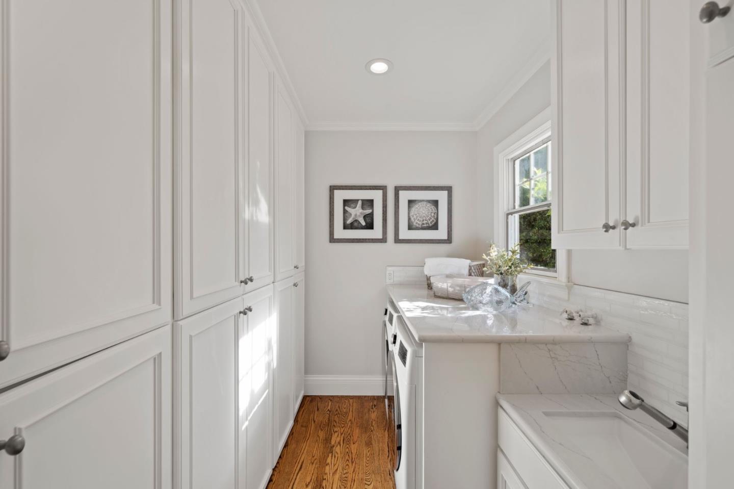 445 Hillcrest Road San Mateo, CA 94402 - Photo 15 of 41 a bathroom with a sink a toilet and vanity