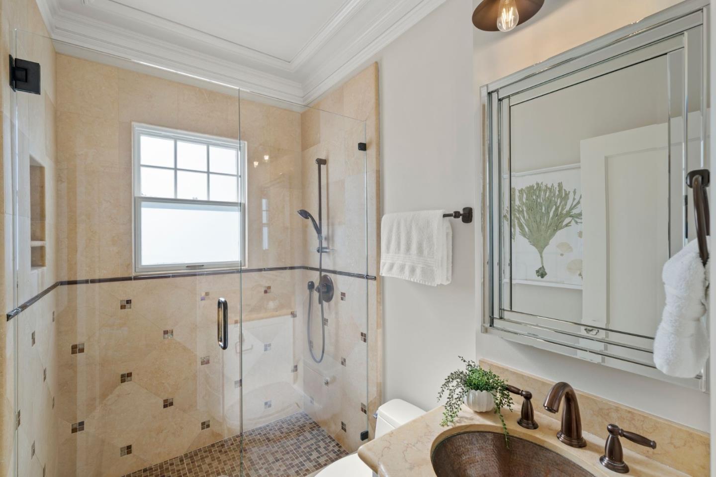 445 Hillcrest Road San Mateo, CA 94402 - Photo 16 of 41 a bathroom with a granite countertop sink a mirror and a shower