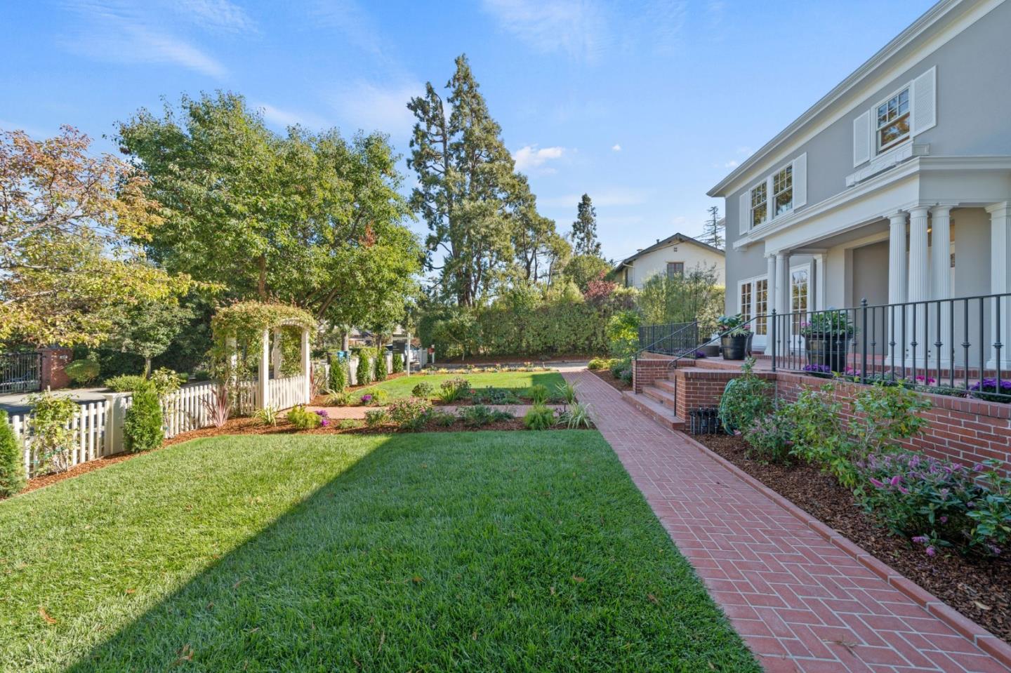 445 Hillcrest Road San Mateo, CA 94402 - Photo 2 of 41 a view of a yard with plants and trees