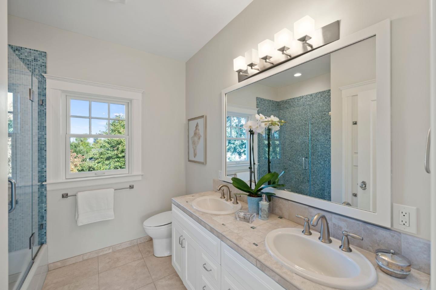 445 Hillcrest Road San Mateo, CA 94402 - Photo 22 of 41 a bathroom with a granite countertop sink a large mirror and a toilet