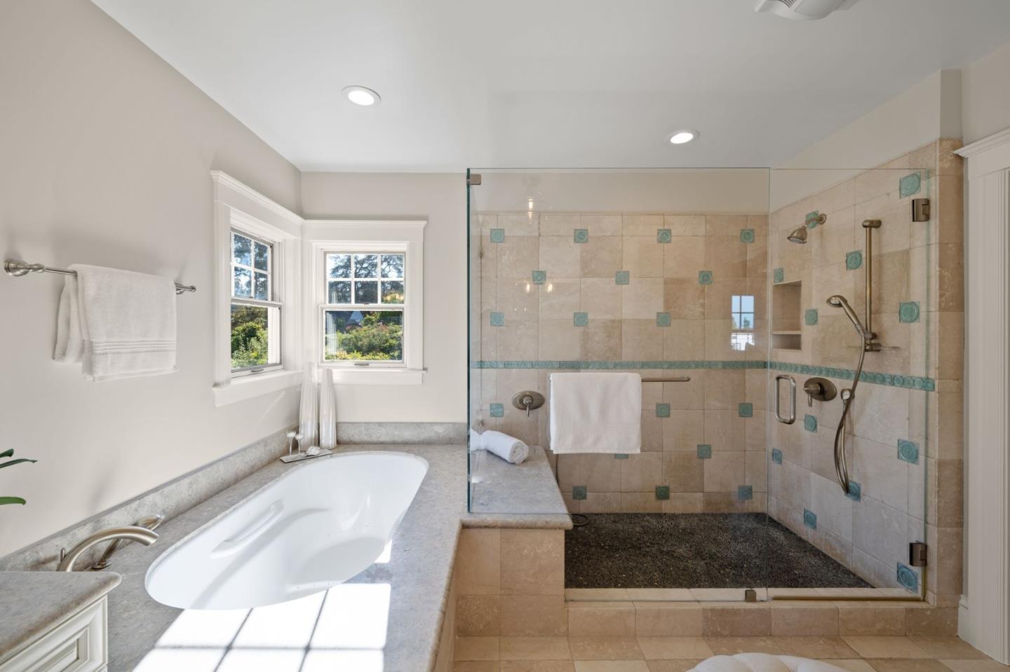 445 Hillcrest Road San Mateo, CA 94402 - Photo 28 of 41 a spacious bathroom with a granite countertop tub shower and mirror