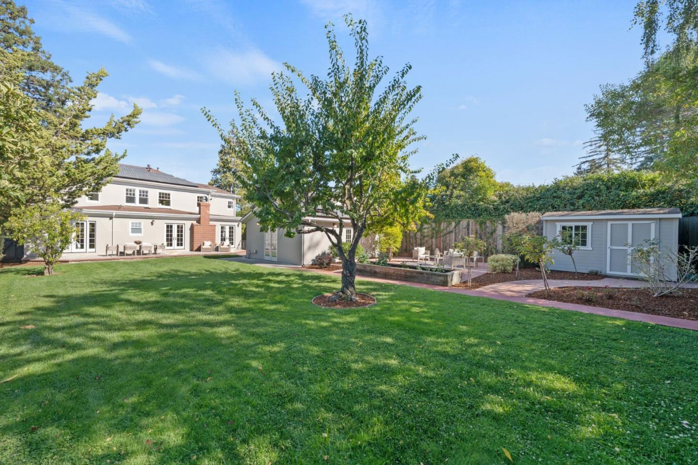 445 Hillcrest Road San Mateo, CA 94402 - Photo 33 of 41 a view of a house with a yard and sitting area