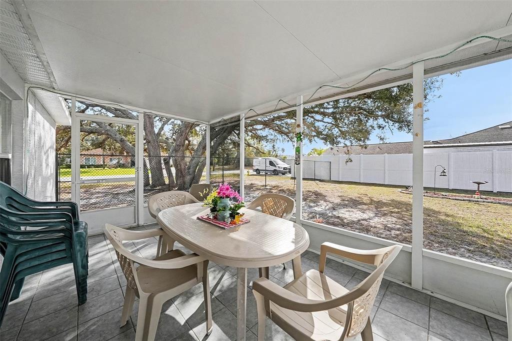 3267 Guava Lane Spring Hill, FL 34609 - Photo 23 of 30 a outdoor dining space with furniture and outdoor view