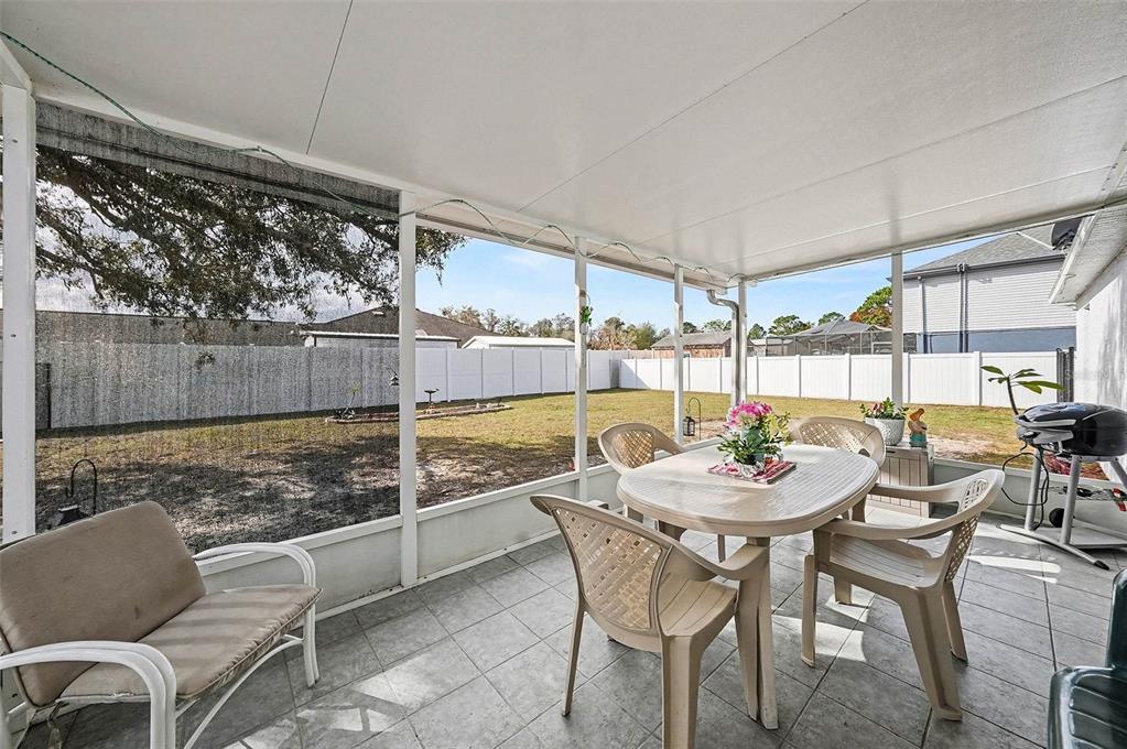 3267 Guava Lane Spring Hill, FL 34609 - Photo 24 of 30 a outdoor dining space with furniture and outdoor view