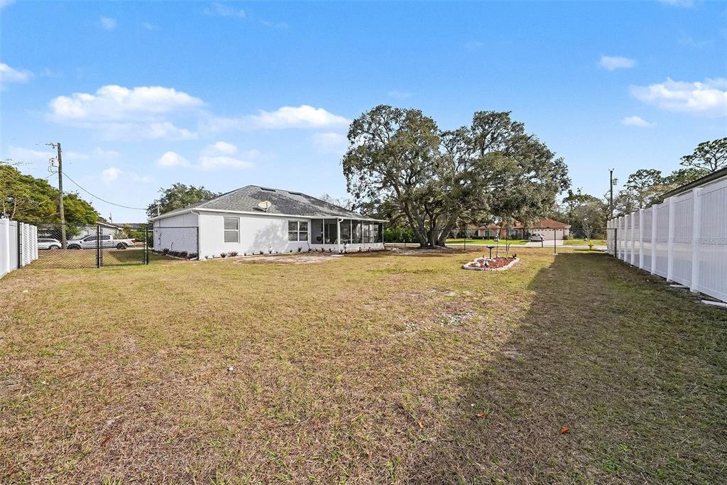 3267 Guava Lane Spring Hill, FL 34609 - Photo 30 of 30 a view of a house with a yard